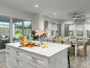Spacious kitchen area with plenty of space for cooking meals.