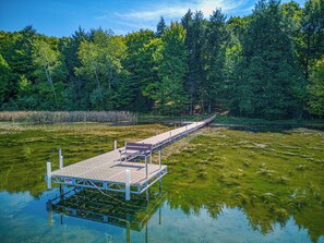 Private dock at Majestic Maples - A new private dock is a great place to tie up your boat or a rental.  Power is available at the lakeshore to charge your batteries.