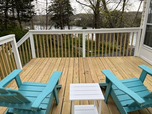 Brand new large deck off the back of the unit with partial views of the water.