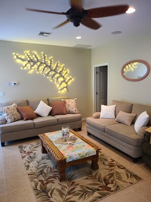 Living room with plenty of seating and recliner. 