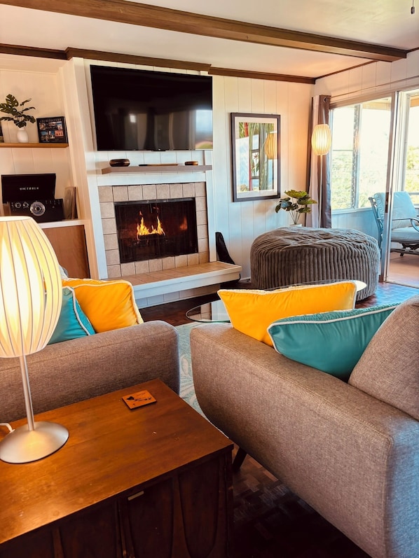 Lounge in the living room with a wood fire