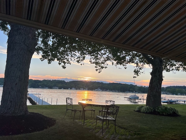 Enjoy a tranquil sunset by the lake; this serene setting on the highly-sought-after McPherson's Point offers the perfect backdrop for evening relaxation and social gatherings under the beautiful skies on Conesus Lake.