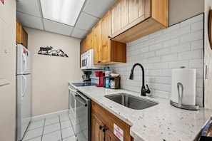 Fully-equipped kitchen includes everything you need to cook meals in or enjoy takeout from a local restaurant.