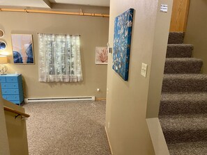 Entrance into Eclipse condo, bedroom up and down the stairs.