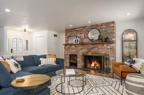 Relax by the wood burning fireplace while looking out onto the golf course.