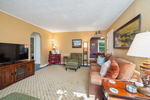 Living room with woodstove, DVD player, Smart TV sleeper sofa