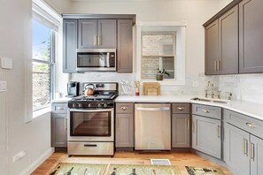 Fully stocked kitchen, main floor, access to backyard, coffee maker and k-cups, stainless steel appliances
