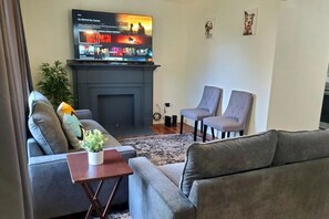 Relax in our cozy living room, complete with television for your ultimate comfort and relaxation.