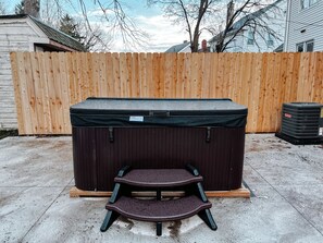"Pamper yourself in our soothing hot tub, the perfect way to unwind and recharge."
