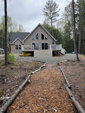 Deck with Solostove, Grill, and Outdoor Dining Table with Umbrella