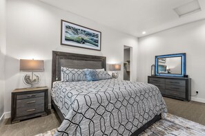 A king bed in the primary bedroom with lots of space an an enormous ensuite bathroom and walk in closet