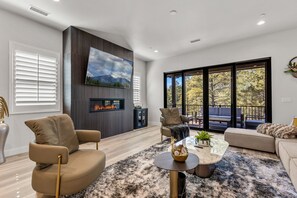Enjoy the fireplace and outdoor space overlooking the Ponderosa Pines