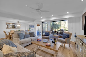 Designed for socializing, this meticulously appointed indoor-outdoor space invites you to unwind and connect with loved ones.