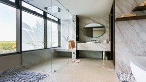 Elegant marble bathroom with nature views at Garza Blanca Cancun.