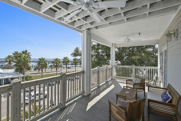 Step onto the balcony and immerse yourself in a scene of pure coastal allure. The tranquil harbor, dotted with graceful sailboats, stretches toward the shimmering expanse of the Gulf of Mexico. Near New Orleans, LA, Gulfport, MS, Biloxi, MS