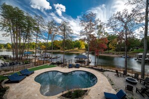 Black Bear- backyard with plenty of seating options, pool, grill, pergola and fire pit. 