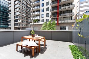 A large private balcony with a setting all to yourself.