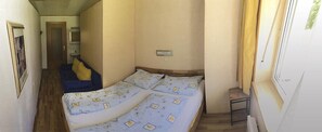 Bedroom with double bed and sofa bed
