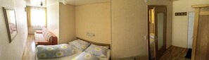 large bedroom with double bed and sofa bed