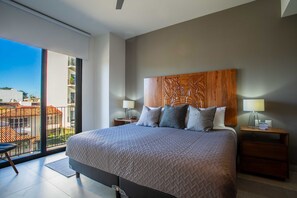 The master bedroom features a comfortable king size bed, smart TV and ensuite bathroom