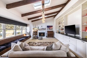 The Lounge with working fireplace and full sized futon couch.