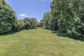 Fenced in yard. 3 open lots with vegetable garden for your enjoyment.