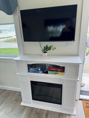 Electric fireplace, 42” TV and card/board games for the family