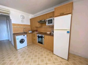 Fully equipped kitchen with washing machine oven microwave refridgerator