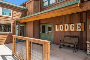 Solitude Moose Room 102 - Front entrance doors for Solitude Lodge building, and door to Gathering Room.