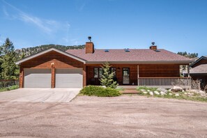 Cascade - Cascade Estes Park Exterior view of the home with two car garage