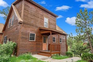 Exterior of Eagle 7, with front door and small porch.
