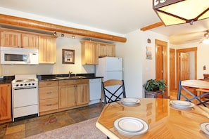 The open-concept floor plan means easy access from kitchen to dining area