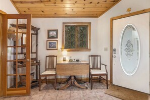 Kittery West - Kittery West Estes Park, Entryway front door, with table and 2 chairs.