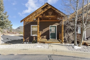 Front view of the townhouse style condo, single step up from parking lot to deck and condo entrance.