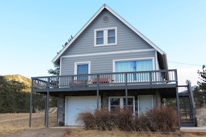 Grandma's Mountain Getaway - View of the front of the home with garage and stairs that lead to the deck and front door