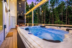 {HOT TUB} Soak in the hot tub with a view of towering pine trees and outdoor fire place