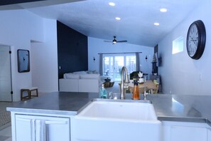 Farm sink, dishwasher and stainless steel countertops
