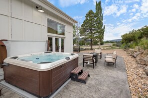 Enjoy a relaxing soak in our Bullfrog brand hot tub, located on the back patio.