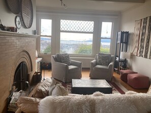 Living room with wood burning fireplace