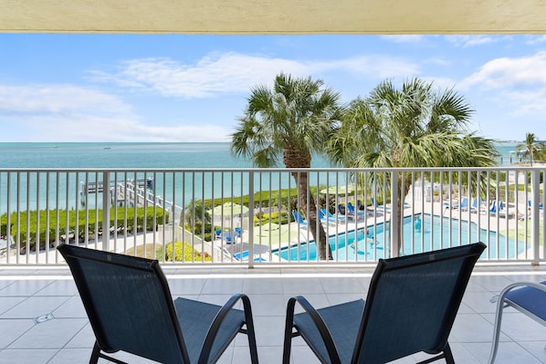 Oceanfront balcony, overlooking fishing pier and pool with huge sunset views
