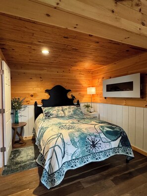 Bedroom area with your cozy electric fireplace.