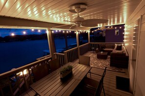 Covered back porch with bistro lights