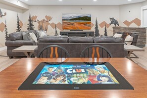 Get ready to play in our basement family room, where an Infinity Game Table awaits your next gaming adventure. With limitless possibilities, let the games begin!