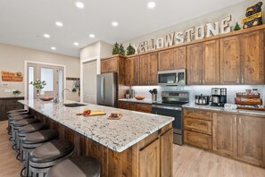 Welcome to a culinary haven where the magic of cooking meets the convenience of modern appliances. After a day exploring the park, gather around the kitchen's spacious island to prep dinner or make a delicious dessert.