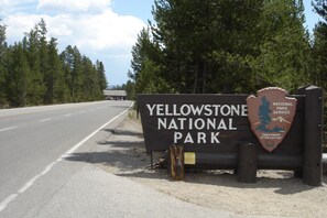 Less than a mile from the West Gate - We offer easy access to unforgettable adventures. Spend your days hiking, wildlife watching, & exploring the park's wonders then return to Gibbon Meadows Lodge to relax!