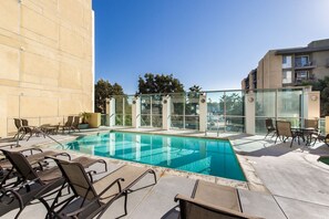 Dive into relaxation and soak up the sun in our inviting swimming pool oasis.