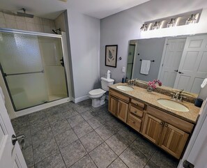 Large primary bedroom - walk in shower with multiple shower heads. 