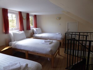 Upper bedroom with 3 single beds