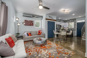 Living Room w/ Sofa Bed, Futon, & Smart TV