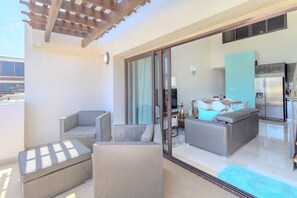 Take in the breathtaking views and gentle island breezes from the balcony of Palm Aruba. With two comfortable chairs inviting you to unwind, this serene outdoor space offers the perfect setting to relax and soak up the beauty of your surrounding